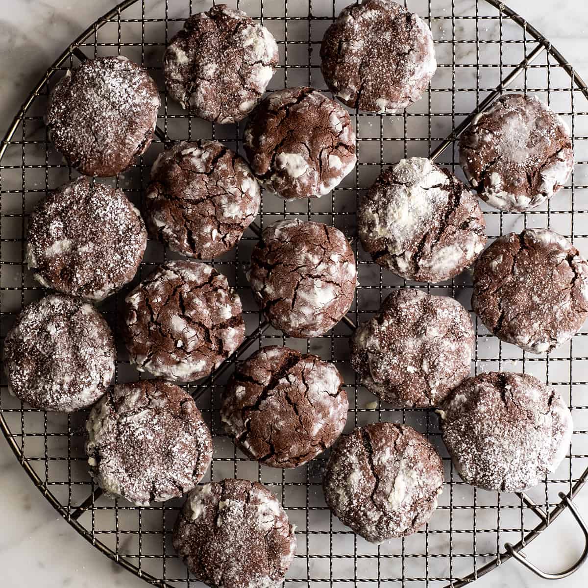 18 chocolate crinkles on a wire cooling rack